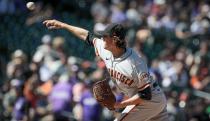 San Francisco Giants starting pitcher Kevin Gausman delivers in the first inning of a baseball game against the Colorado Rockies in Denver, Sunday, Sept. 26, 2021. (AP Photo/Joe Mahoney)