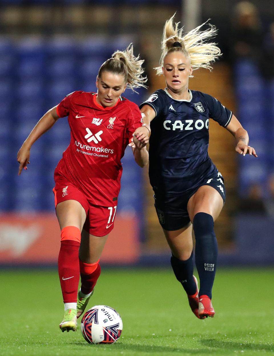 BIRKENHEAD, ENGLAND - OCTOBER 13: Melissa Lawley of Liverpool battles for possession with Alisha Lehmann of Aston Villa during the FA Women's Continental Tyres League Cup match between Liverpool and Aston Villa at Prenton Park on October 13, 2021 in Birkenhead, England. (Photo by Lewis Storey/Getty Images)