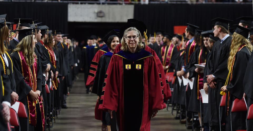 Iowa State University president Wendy Wintersteen walks down the aisle during the procession in the university Spring Commencement Ceremony at Hilton Coliseum Saturday, May 14, 2022, in Ames, Iowa.