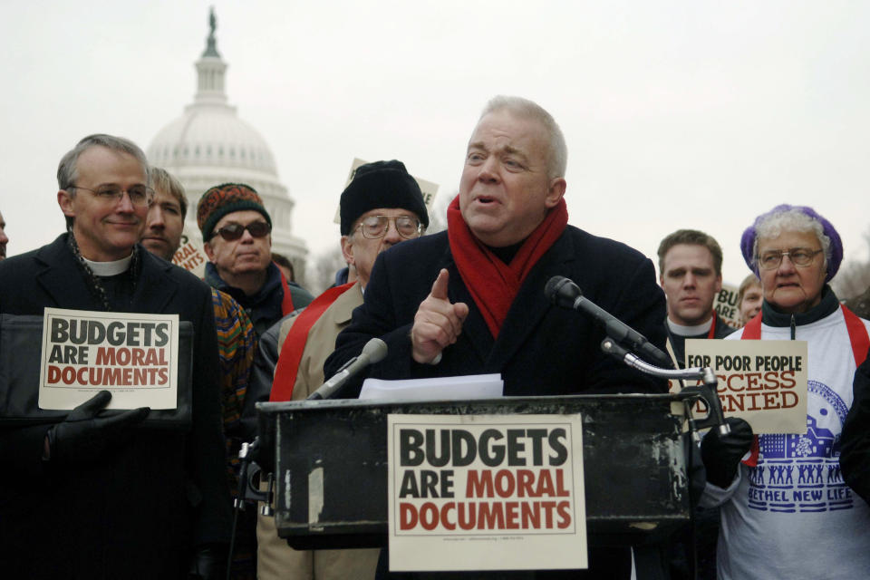 FILE - In this Wednesday, Dec. 14, 2005 file photo, Jim Wallis, a founder of Sojourners - Christians for justice and peace, speaks at a news conference on the steps of the Cannon House Office Building in Washington. as religious-based activists protested over proposed Republican cuts to Medicaid and other programs for the poor. As a nation shaken by political divisions prepares to inaugurate a new president on Wednesday, Jan. 20, 2021, a group of Christian leaders, including Wallis, are preparing to meet the tense moment with prayer during three days of ecumenical, nonpartisan programming organized under the umbrella of #PeaceWithJustice. (AP Photo/Kevin Wolf)