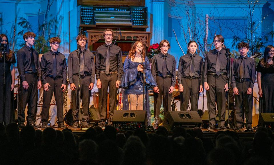 Cara Brindisi performs with the Shrewsbury High School Choir at Mechanics Hall Friday.