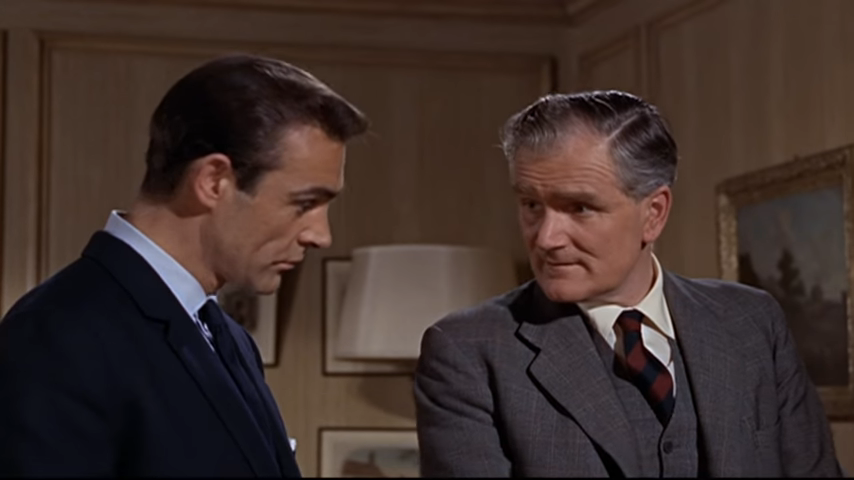 Desmond as Q in M's office with Sean Connery as James Bond