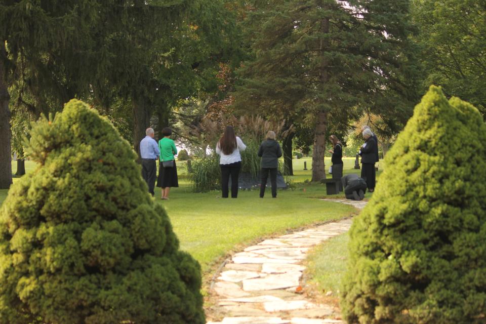 People pray during the National Day of Remembrance for Aborted Children on Sept. 9, 2023, at the St. Joseph Cemetery in Lansing.