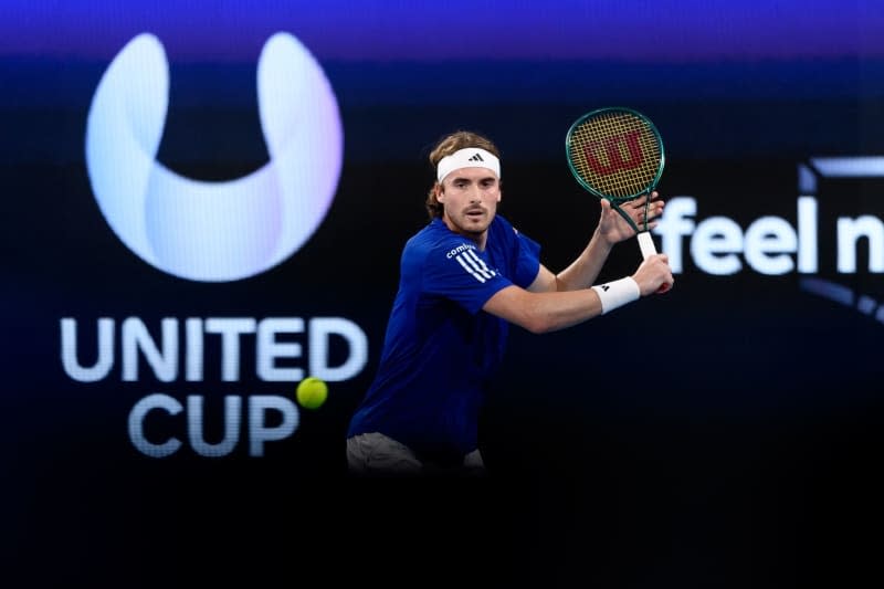 Greek tennis player Stefanos Tsitsipas in action against Germany's Alexander Zverev during their men's singles quarter-final match of the 2024 United Cup at Ken Rosewall Arena in Sydney. Steven Markham/AAP/dpa