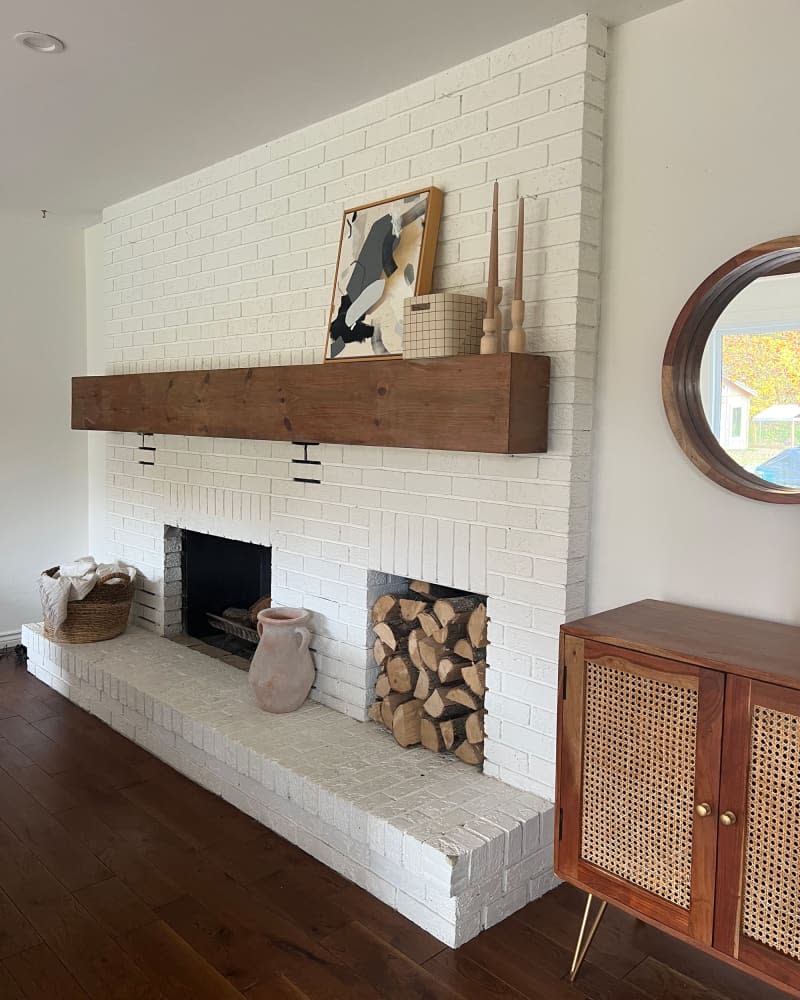 Decorative terra cotta urn on fireplace base.