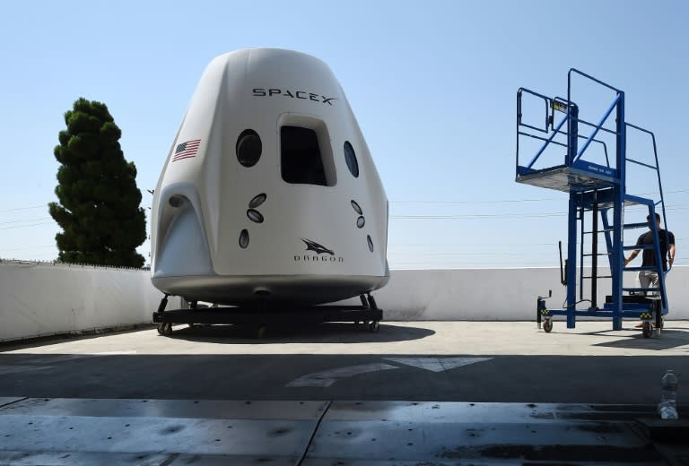 A mock up of the Crew Dragon spacecraft is displayed during a media tour of SpaceX headquarters and rocket factory in Hawthorne, California