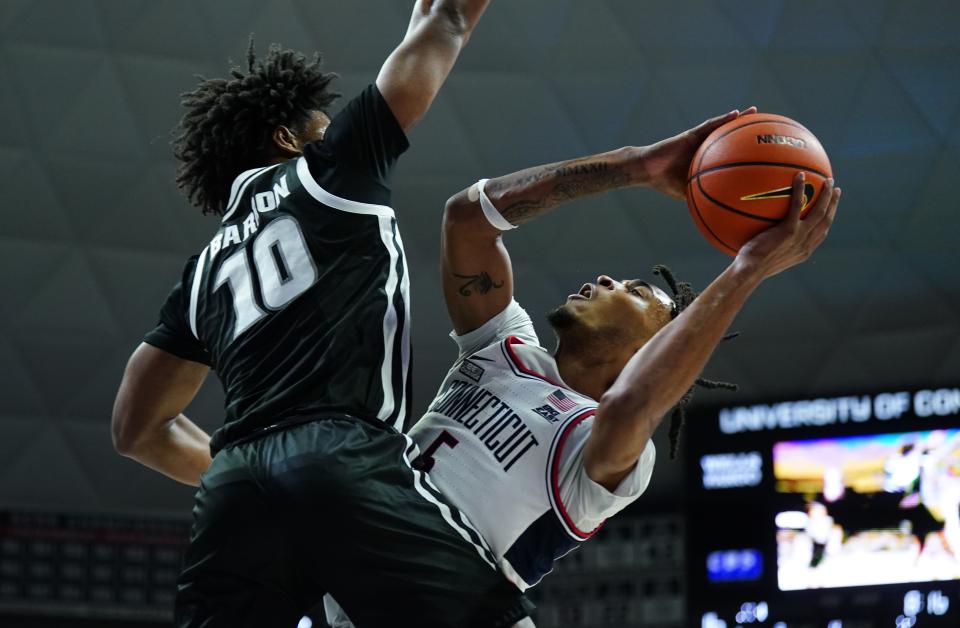 Providence Friars forward Rich Barron (10) defends against UConn Huskies guard Stephon Castle (5) in the first half of their Jan. 31 game at Gampel Pavilion.