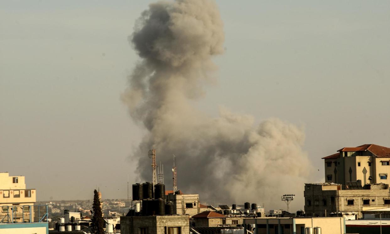 <span>Smoke billows on the horizon after an Israeli airstrike in Rafah in the southern Gaza Strip on Thursday.</span><span>Photograph: Ismael Mohamad/UPI/Rex/Shutterstock</span>