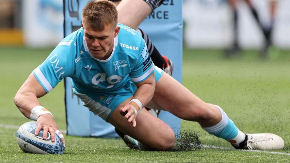 Joe Carpenter of Sale Sharks goes over for a try during the Gallagher Premiership Rugby match between Newcastle Falcons and Sale Sharks at Kingston Park on April 28, 2024 in Newcastle upon Tyne, England. 