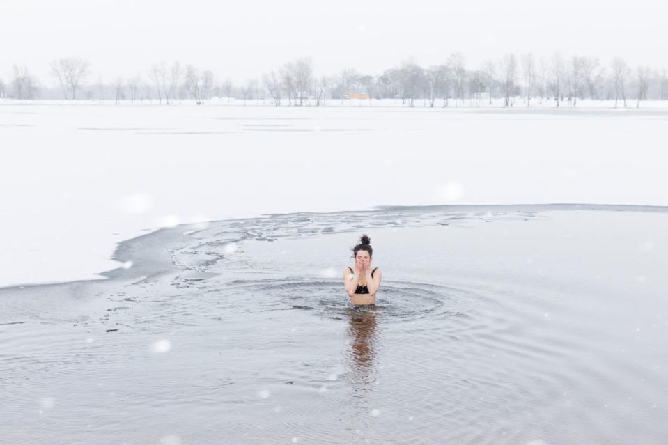 A woman plunges into the icy water of the Dnipro River to celebrate Epiphany in Kyiv, Ukraine, on Jan. 6, 2024. (Mykhaylo Palinchak/Global Images Ukraine/Getty Images)