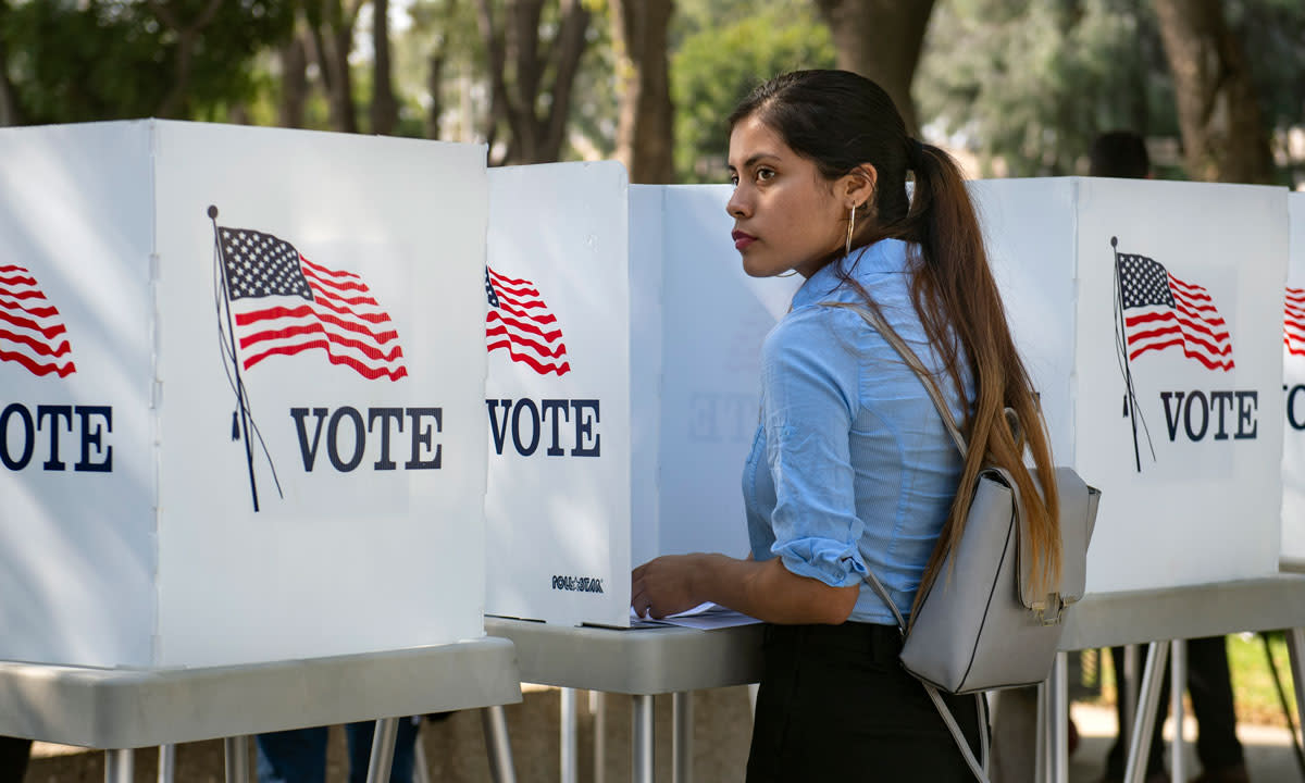 A college student at a polling site