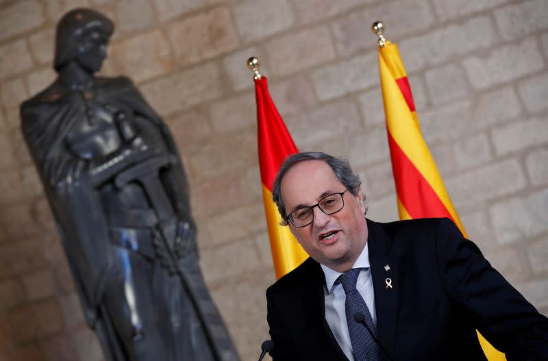 FILE PHOTO: Spain's PM Sanchez and Catalan regional leader Torra meet in Barcelona