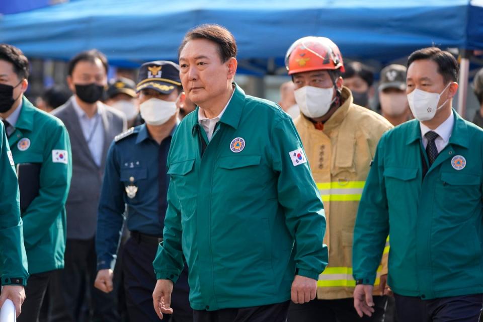 South Korean President Yoon Suk Yeol visited the scene on Sunday morning (AP)