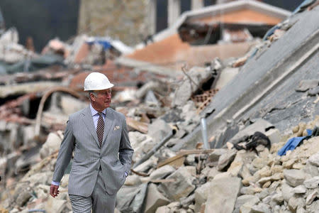 Britain's Prince Charles walks during his visit to the town of Amatrice, which was levelled after an earthquake last year, in central Italy April 2, 2017. REUTERS/Emiliano Grillotti