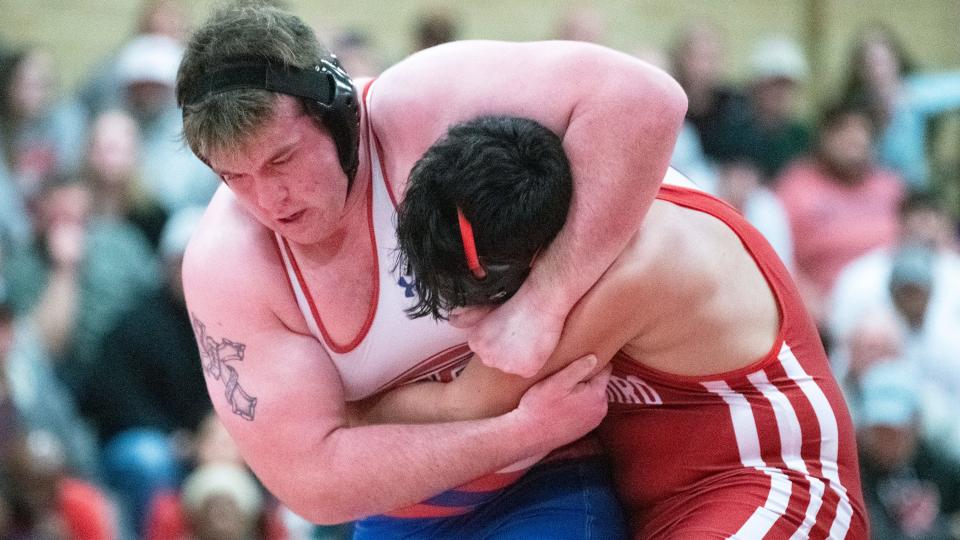 Washington Township's Shane Tait, left, battles Paulsboro's Jordan Eli for a takedown during the 285 lb. bout of the wrestling meet held at Paulsboro High School on Friday, January 20, 2023.  Tait defeated Eli, 6-3.  