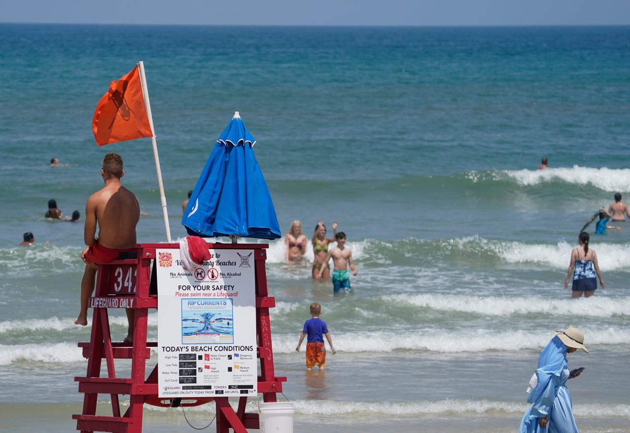 A lifeguard watches the water in front of a tower in this file photo taken in Daytona Beach, Wednesday, June 28, 2023.