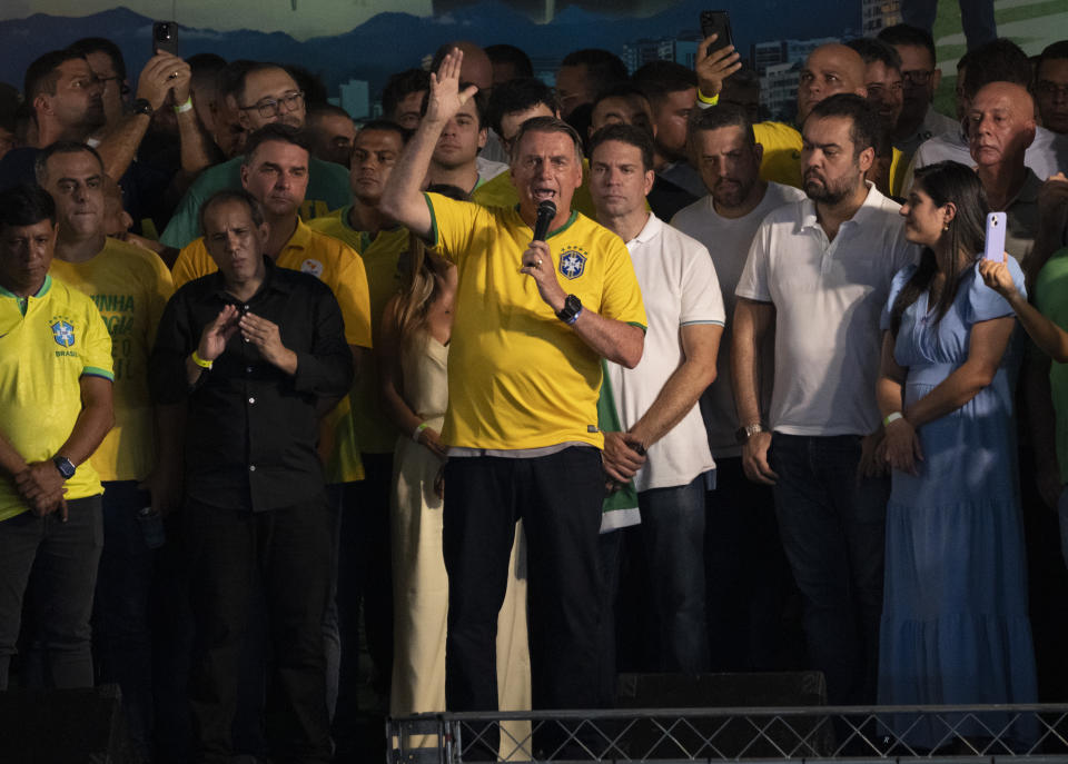 Brazil's former President Jair Bolsonaro speaks at the launch of the pre-candidacy of Alexandre Ramagem, center right, for the Rio de Janeiro's mayoral elections in Rio de Janeiro, Brazil, Saturday, March 16, 2024. (AP Photo/Silvia Izquierdo)