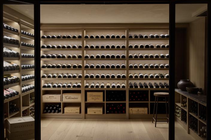 AFTER: The lower level was converted into an immaculate wine cellar to showcase the clients’ love of vino.