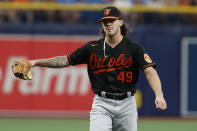 Baltimore Orioles starting pitcher DL Hall reacts during the first inning of a baseball game against the Tampa Bay Rays, Saturday, Aug. 13, 2022, in St. Petersburg, Fla. Hall was making his major league debut. (AP Photo/Scott Audette)