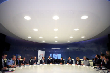 French President Emmanuel Macron (C) presides over an emergency crisis meeting with French Prime Minister Edouard Philippe (center L), French junior Minister for Interior Laurent Nunez (L), French Interior Minister Christophe Castaner (center R) and French Justice Minister Nicole Beloubet (R) at the Interior Ministry in Paris, France, late 16 March 2019. Christophe Petit Tesson/Pool via REUTERS