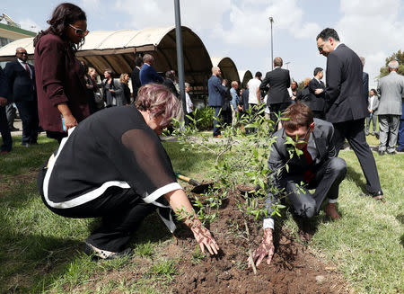 Canadian relatives of the Ethiopian Flight ET 302 plane crash victims plant a memorial tree during a memorial ceremony at the Embassy of Canada in Addis Ababa, Ethiopia, March 26, 2019. REUTERS/Tiksa Negeri