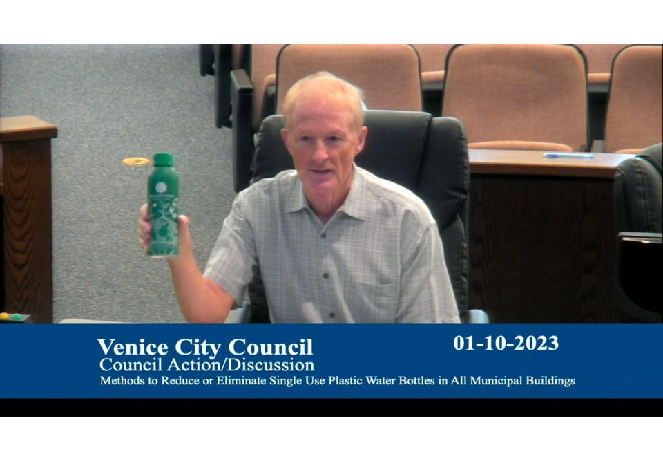 Venice Environmental Advisory Board Chairman Tom Jones used green metal refillable bottle to illustrate his point that the city could use something similar to raise awareness of stations to refill water bottles in the city.