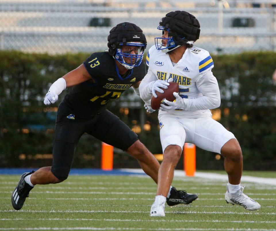 Delaware defensive back Jared Duncan (13) moves in on wide receiver James Collins during the Blue and White Spring Game capping spring drills, Friday, April 21, 2023 at Delaware Stadium.