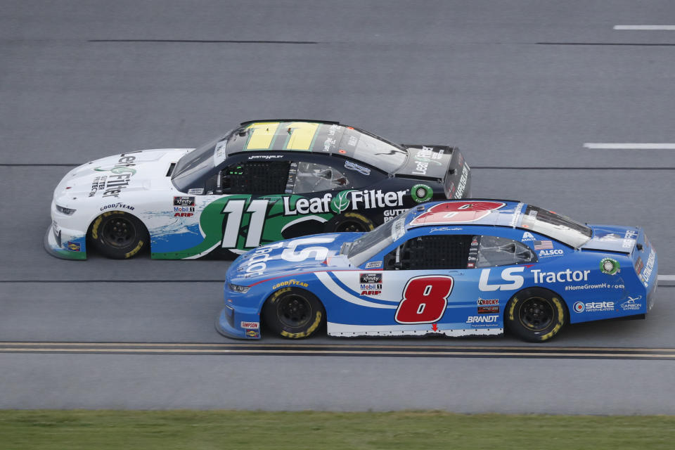 Justin Haley (11) passes Jeb Burton during a NASCAR Xfinity auto race at Talladega Superspeedway in Talladega Ala., Saturday, June 20, 2020. (AP Photo/John Bazemore)