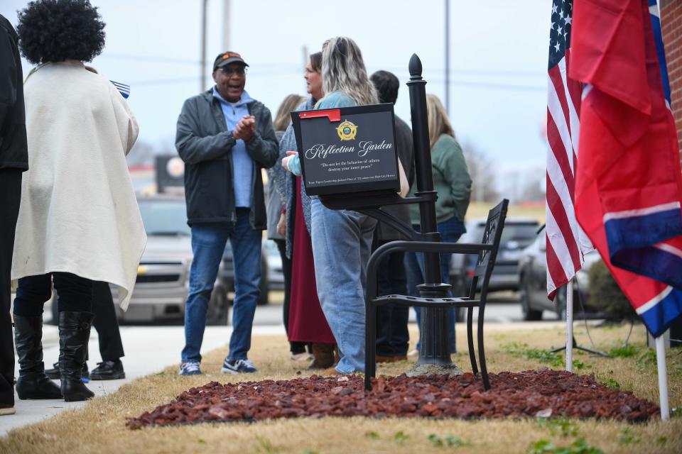 Attendees mingle near the mailbox where citizens can send letters of encouragements to law enforcement during the opening of the 'Reflection Garden' at J. Alexander Leech Criminal Justice Complex in Jackson, Tenn., on Wednesday, Jan. 3, 2024.