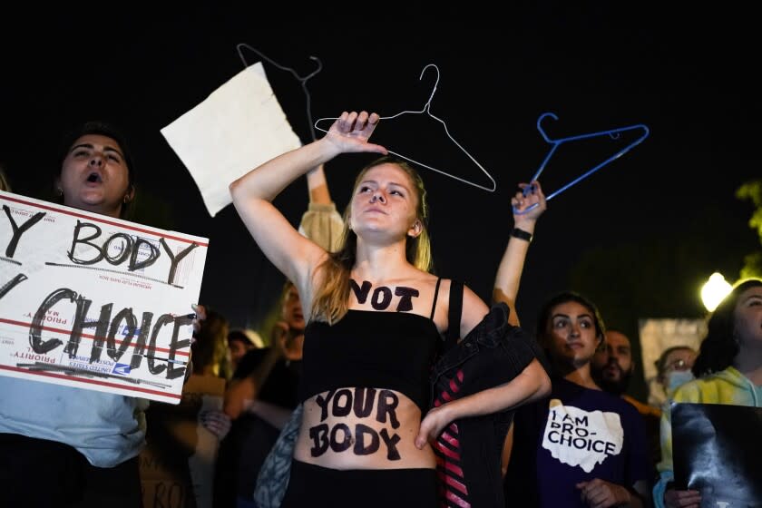 A crowd gathers outside the Supreme Court on Monday night after a purported leak says that Roe vs. Wade will be overturned on May 2, 2022.