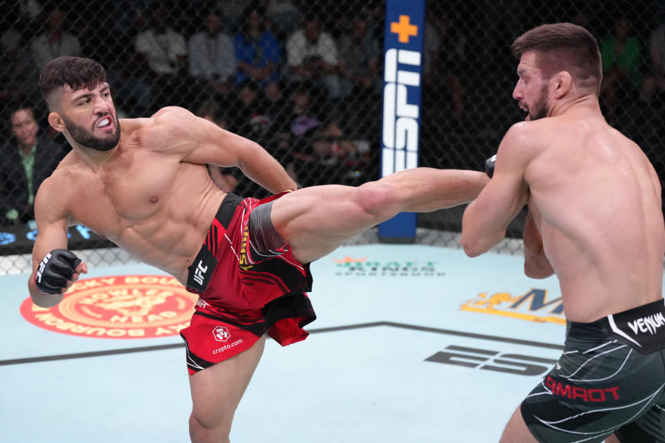 LAS VEGAS, NEVADA – JUNE 25: (L-R) Arman Tsarukyan of Georgia kicks Mateusz Gamrot of <a class="link " href="https://sports.yahoo.com/soccer/teams/poland/" data-i13n="sec:content-canvas;subsec:anchor_text;elm:context_link" data-ylk="slk:Poland;sec:content-canvas;subsec:anchor_text;elm:context_link;itc:0">Poland</a> in a lightweight fight during the UFC Fight Night event at UFC APEX on June 25, 2022 in Las Vegas, Nevada. (Photo by Jeff Bottari/Zuffa LLC)