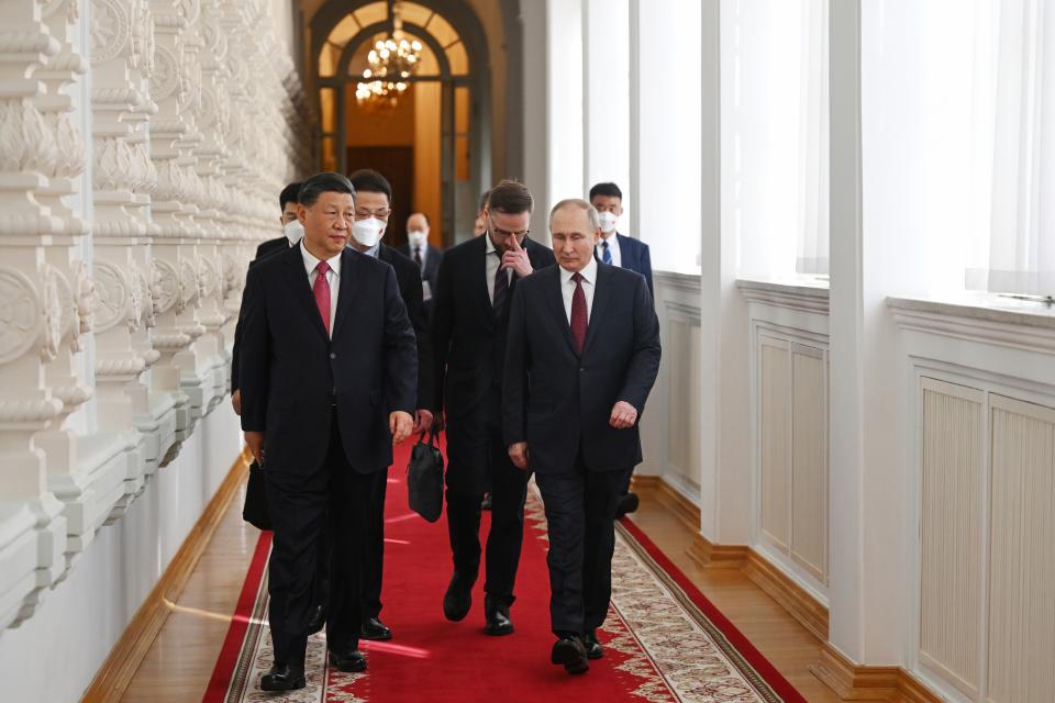 Russian President Vladimir Putin and Chinese President Xi Jinping walk prior to their talks at The Grand Kremlin Palace in the Kremlin in Moscow, Russia, Tuesday, March 21, 2023. (Grigory Sysoyev, Sputnik, Kremlin Pool Photo via AP)