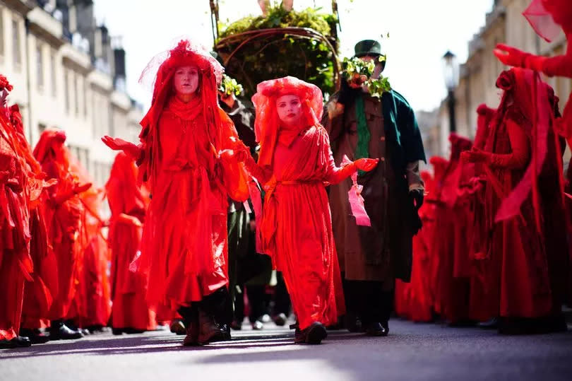 Red Rebels take part in a Funeral for Nature procession in Bath