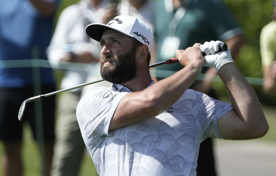 Jon Rahm, of Spain, watches his shot on the first hole during the Mexico Open golf tournament's third round in Puerto Vallarta, Mexico, Saturday, April 29, 2023. (AP Photo/Moises Castillo)