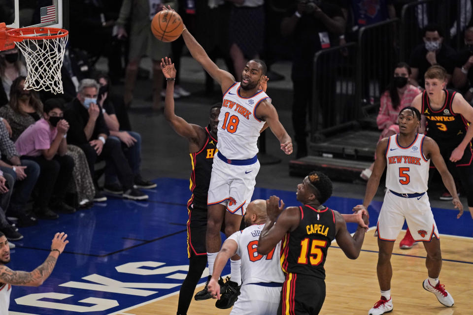 New York Knicks' Alec Burks (18) grabs a rebound during the first half of Game 1 of an NBA basketball first-round playoff series against the Atlanta Hawks, Sunday, May 23, 2021, in New York. (AP Photo/Seth Wenig, Pool)