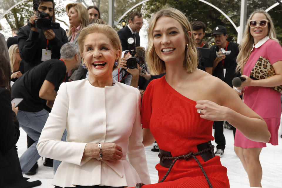 Carolina Herrera, left, poses with model Karlie Kloss before Herrera's namesake collection is modeled during Fashion Week, in New York, Monday, Sept. 9, 2019. (AP Photo/Richard Drew)