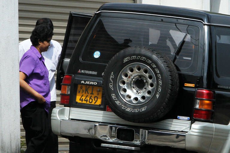 Sri Lanka's impeached Chief Justice Shirani Bandaranayake steps out of her private home in Colombo on January 14, 2013. Sri Lanka's president completed the controversial impeachment of the chief justice by choosing a successor Monday, his spokesman said, as lawyers vowed to keep up a battle for judicial independence