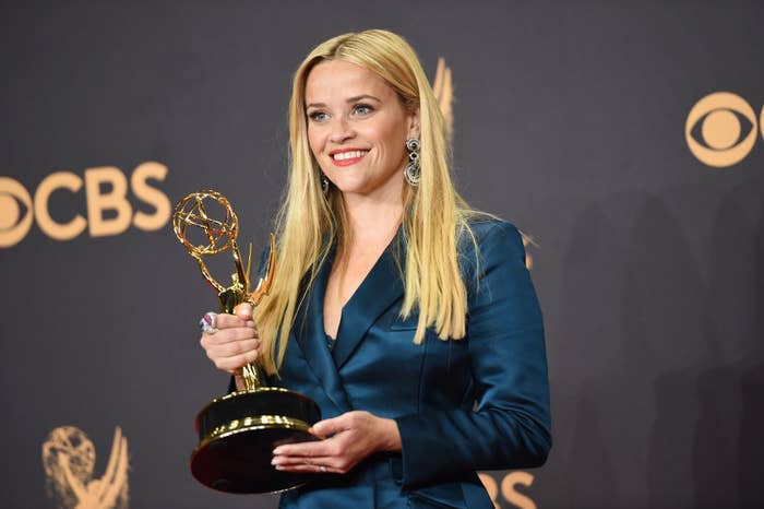 Reese holding an Emmy