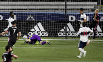 Seattle Sounders forward Raul Ruidiaz, right, celebrates after scoring as Vancouver Whitecaps goalkeeper Evan Bush sprawls on the pitch during the second half of an MLS soccer match in Portland, Ore., Tuesday, Oct. 27, 2020. (AP Photo/Steve Dykes)