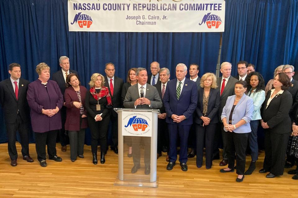 New York State Sen. Jack Martins, center, speaks during a news conference, Wednesday in Westbury, N.Y. Local Republican leaders Wednesday called for the resignation of their new GOP congressman George Santos, who is facing multiple investigations by prosecutors over his personal and campaign finances and lies about his resume and family heritage.