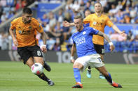 Leicester's James Maddison, right challenges for the ball with Wolverhampton Wanderers' Ruben Neves during the English Premier League soccer match between Leicester City and Wolverhampton Wanderers at the King Power Stadium in Leicester, England, Sunday, Aug.11, 2019. (AP Photo/Rui Vieira)
