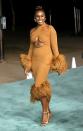 <p>The Emmy-nominated star turned heads in a tan long-sleeved, midriff baring gown embellished with ostrich feathers at the waist and hem, designed by London-based fashion house ROKH.</p>
