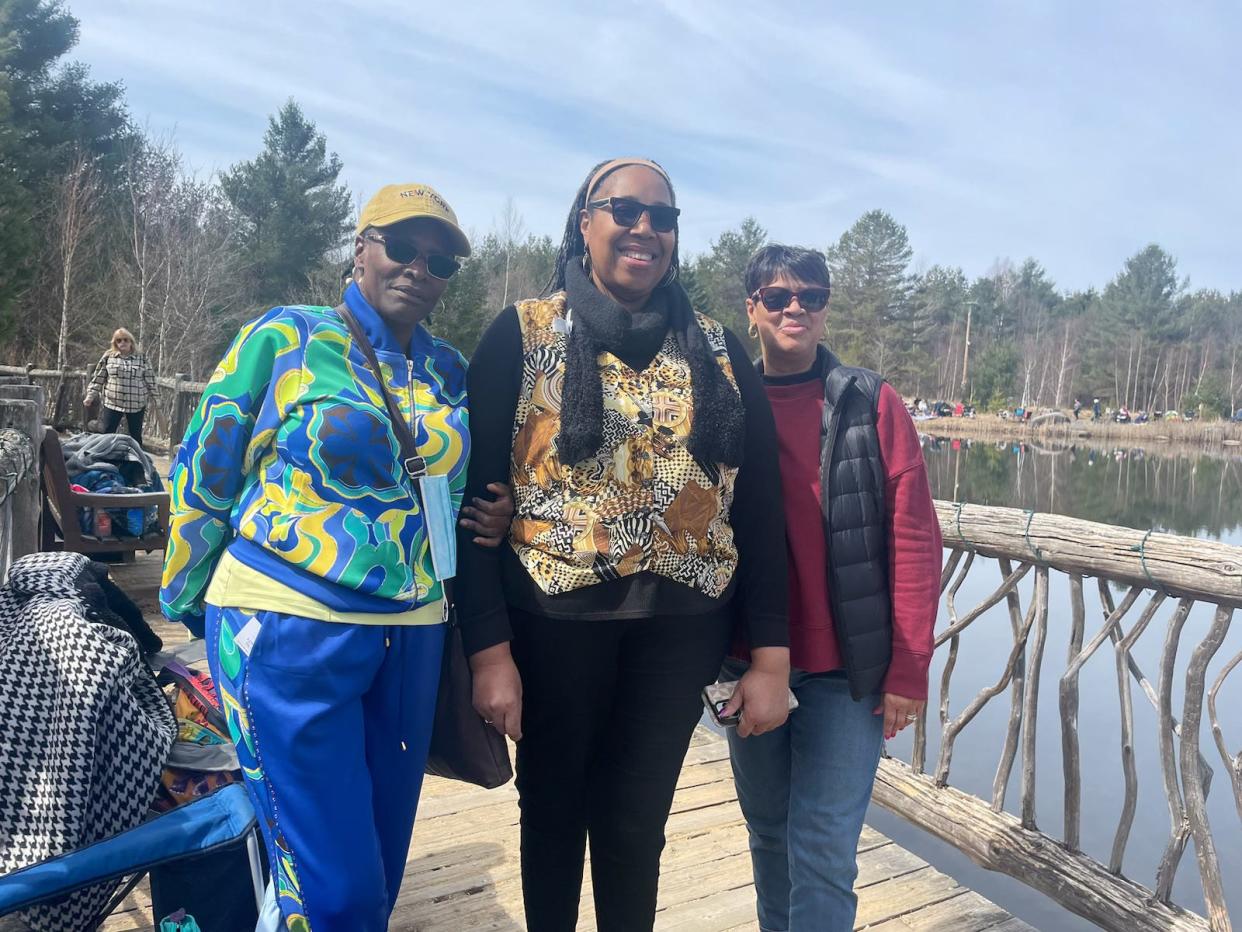 From left, friends Rhonda Griffin, Valerie Temple and Regina DiLella hopped a tour bus from Albany to Tupper Lake's Wild Center to view the eclipse on April 8, 2024.