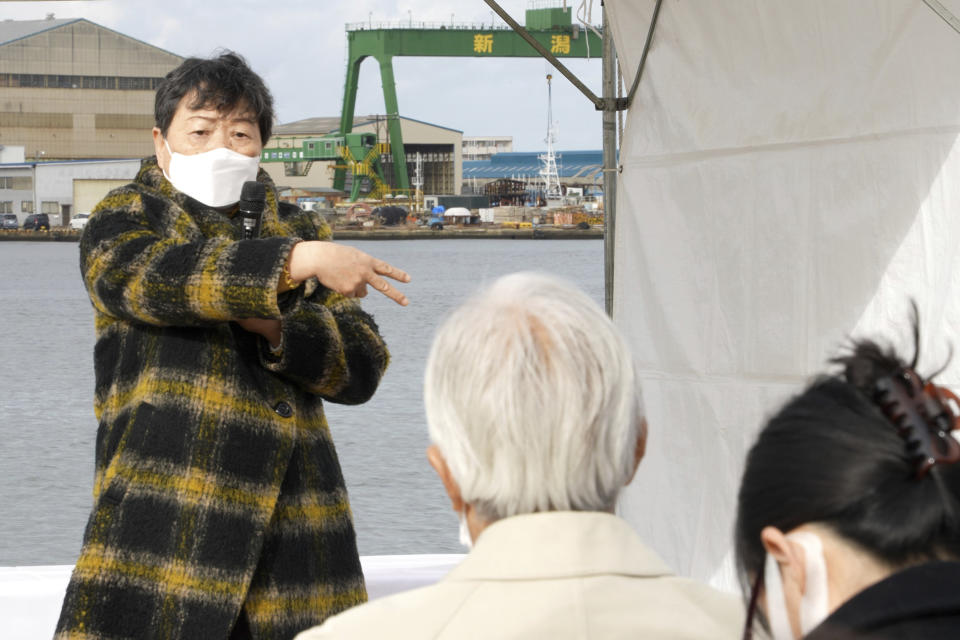 Eiko Kawasaki, 79, talks about her experience in North Korea at a commemoration ceremony for the victims of the resettlement program held at a port in Niigata, northwestern Japan on Dec. 14, 2021. Kawasaki was among some 93,000 ethnic Korean residents in Japan and their relatives who joined a resettlement program led by North Korea only to find the opposite of what was promised. Most were put to brutal manual labor at mines, in forests and on farms and faced discrimination because of Japan's past colonization of the Korean Peninsula. (AP Photo/Chisato Tanaka)