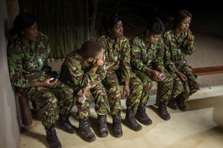 Female members of the anti-poaching team "Black Mambas" conduct a routine patrol through a wildlife reserve on September 25, 2016 in the Limpopo province of South Africa