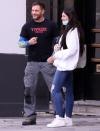 <p>Tom Hardy poses for photos with fans while out and about in London on Monday. </p>