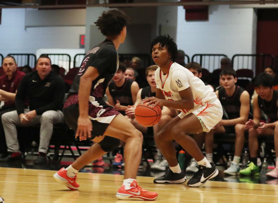 Miles Johnson (0) and White Plains defeated Scarsdale 51-50 in the Slam Dunk Showcase at the Westchester County Center in White Plains Jan. 6, 2024.