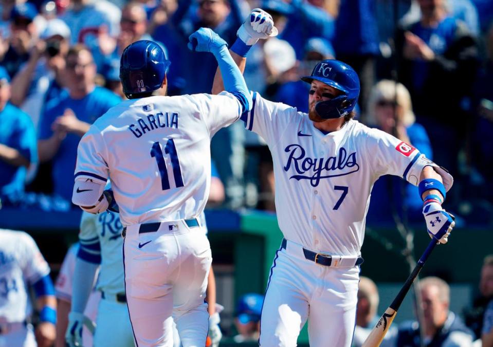 Kansas City Royals third baseman Maikel Garcia (11) is congratulated by shortstop Bobby Witt Jr. (7) after hitting a home run during the first inning against the Minnesota Twins at Kauffman Stadium on March 28, 2024.