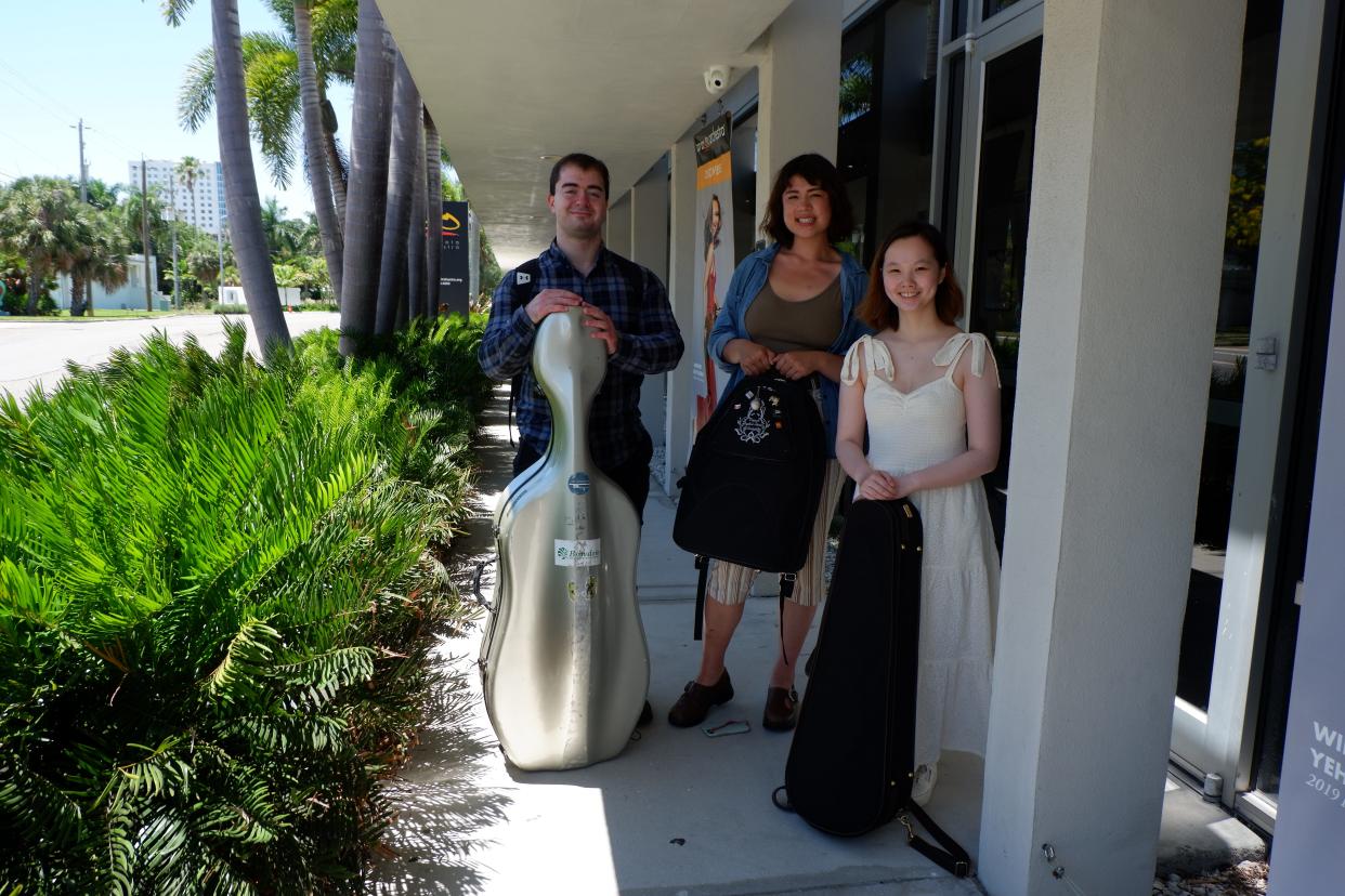 From left, 2022 Sarasota Music Festival fellows Daniel Kaler, Katrina Dunkle and Madeleine Pintoff outside the Beatrice Friedman Symphony Center.