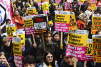 People take part in an anti-fascist counter-demonstration against the "Brexit Betrayal Rally" led by English far-right activist Tommy Robinson who serves as a political adviser to the Leader of the UK Independence Party, UKIP, in central London, Sunday Dec. 9, 2018. Police patrolled the route and separated the two rallies. (Victoria Jones/PA via AP)